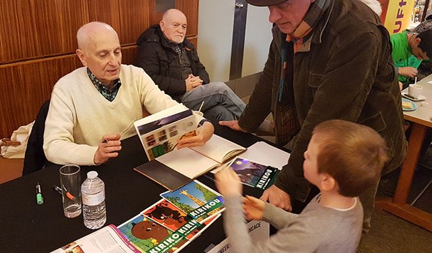 Michel Ocelot signing DVD's for a young fan